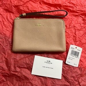 NWT Coach corner zip wristlet in light taupe